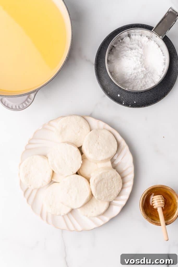 an overhead image showing the measured ingredients needed to make a batch of quick and easy homemade beingets