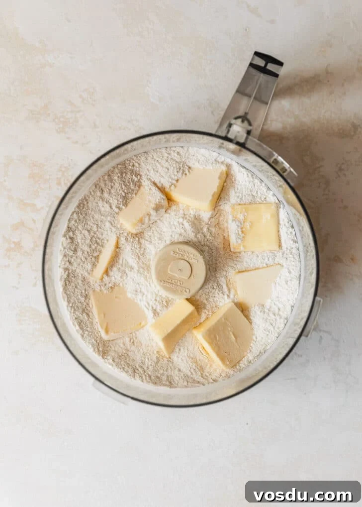 The Ultimate Pie Crust Recipe That Will Wow Your Guests 7 A food processor of flour and butter.
