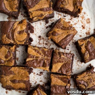 Peanut butter swirl brownies on parchment paper.