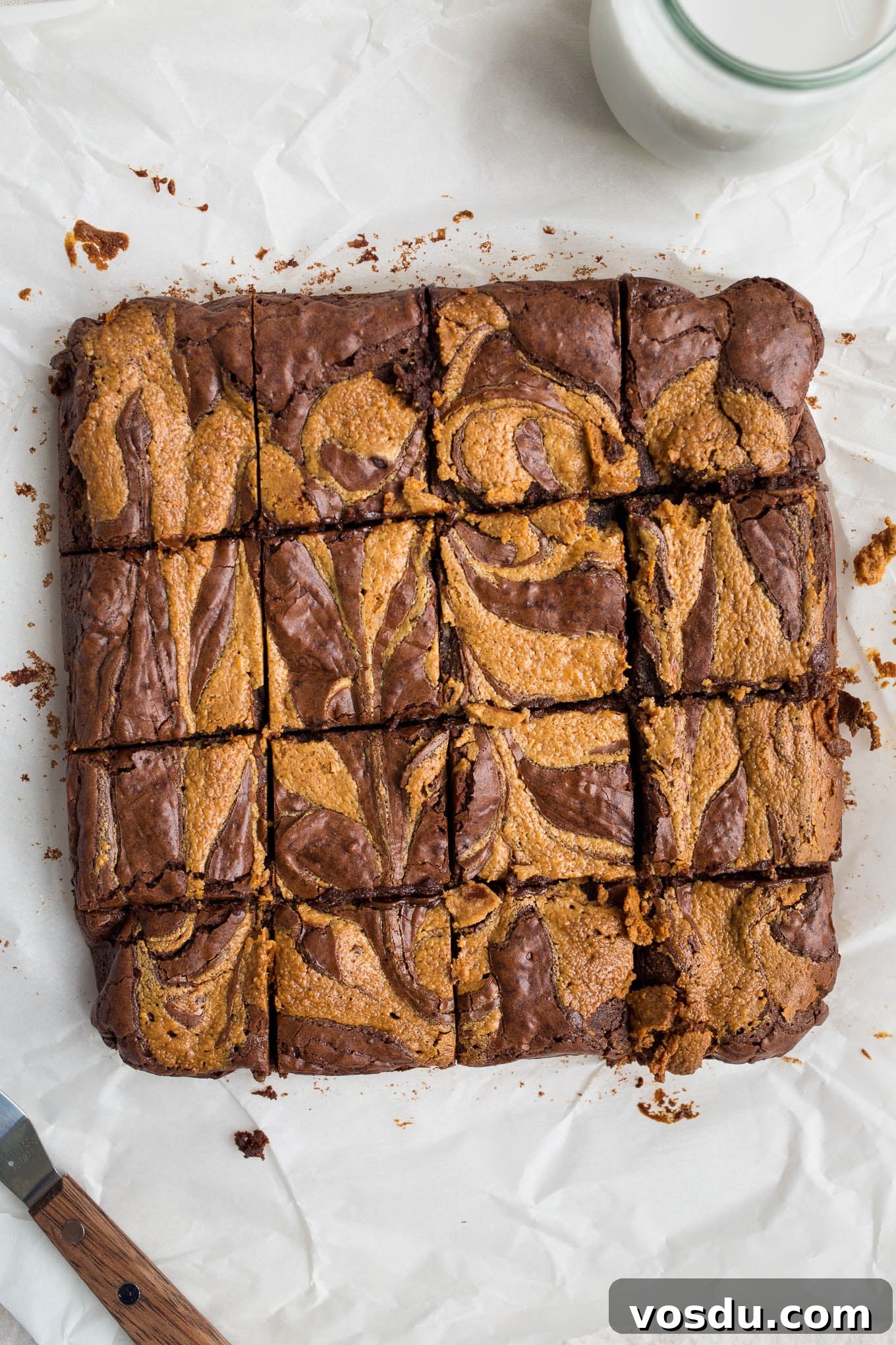 Gluten-Free Peanut Butter Swirl Brownies Recipe 9 baked goods with milk on tablecloth