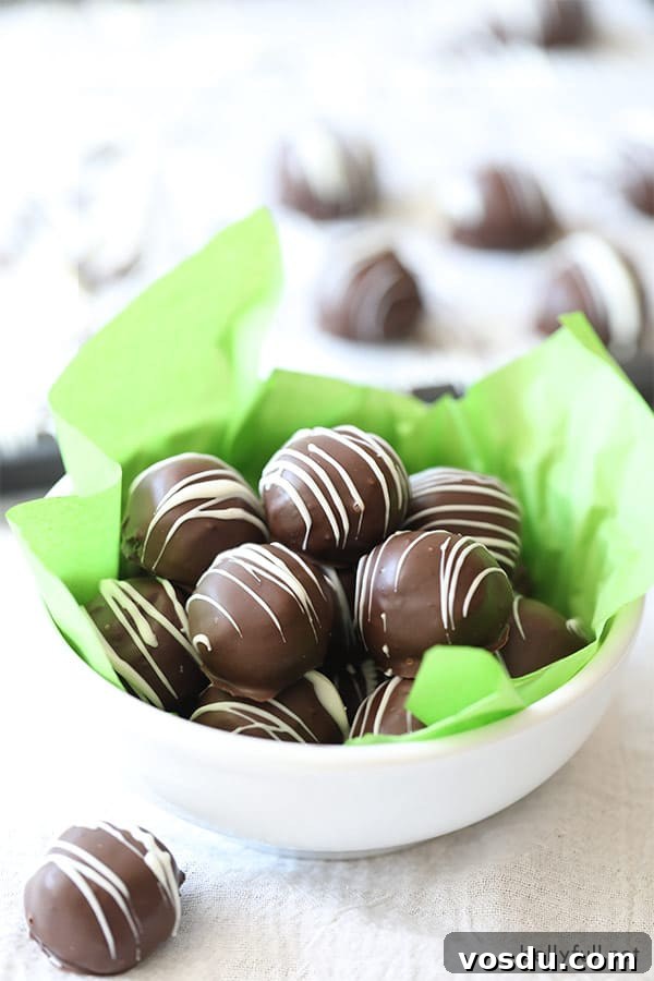 3-Ingredient Oreo Truffles — Quick No-Bake Dessert 5 Oreo Truffles in a white bowl with green tissue paper