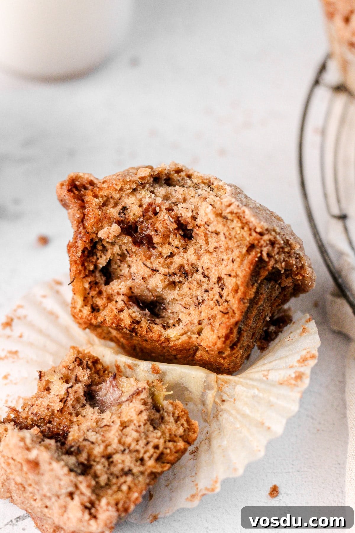 the inside of a banana cinnamon swirl muffin in a parchment cup for baking blog
