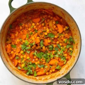 15-Minute Chickpea Stew Recipe for Quick Weeknight Dinners 11 Chickpea stew in a large pot displayed on white bakcground