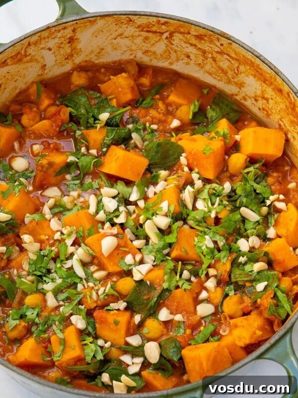 15-Minute Chickpea Stew Recipe for Quick Weeknight Dinners 9 Peanut stew with sweet potatoes in a pot.