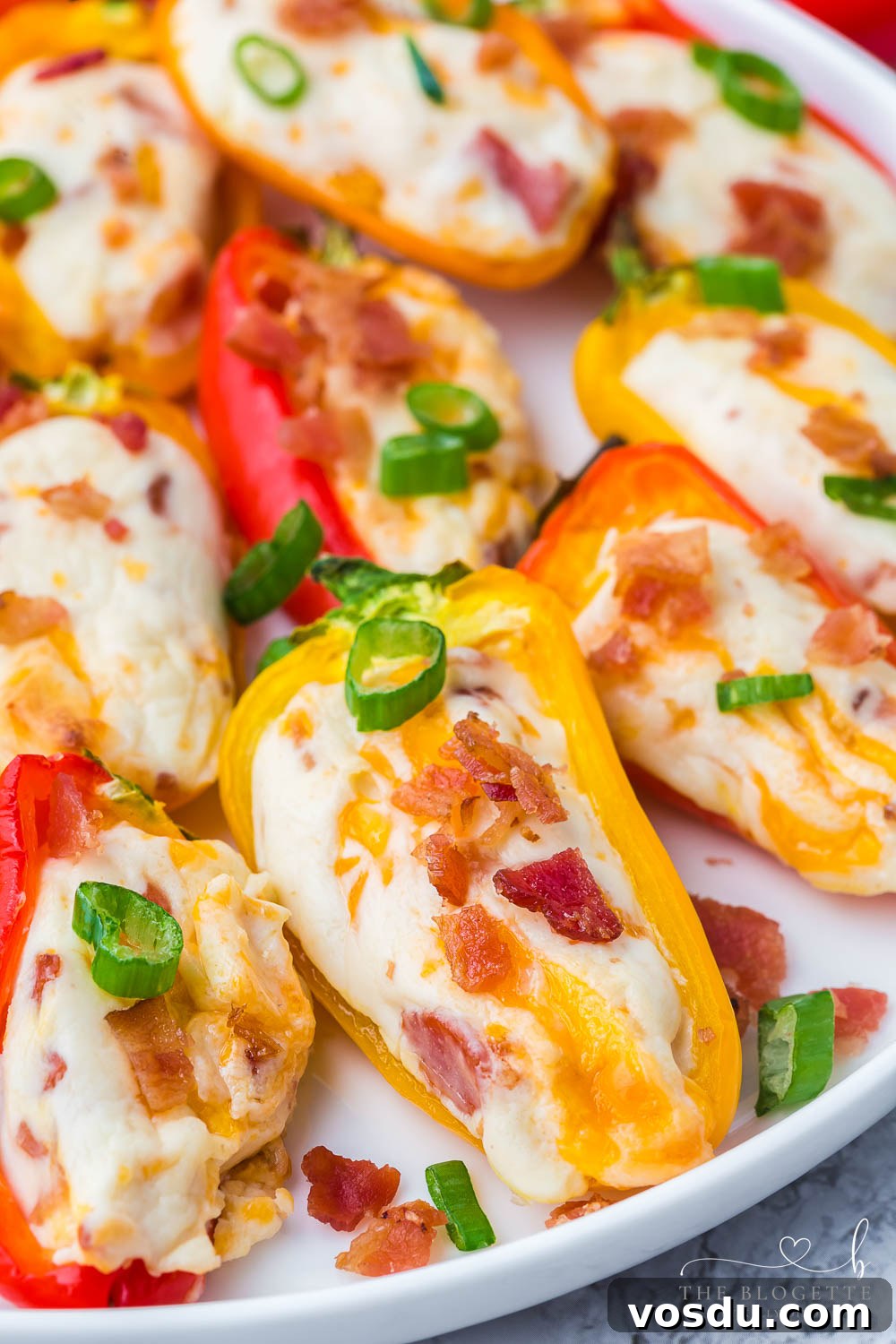 Stuffed Mini Peppers with Cream Cheese and Herbs 10 Cheesy Bacon Stuffed Mini Peppers! An easy appetizer idea for any gathering! Sweet mini peppers overflowing with cheese, bacon, and more!