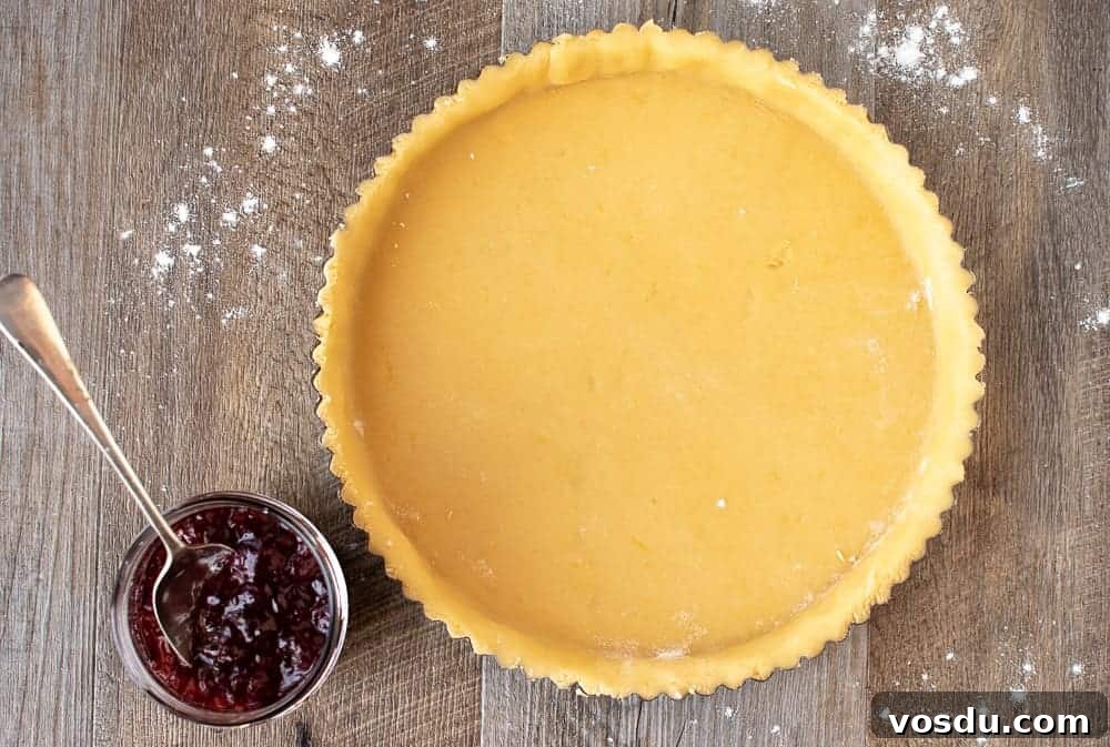 This Strawberry Crostata recipe | Easy Strawberry Tart is an easy Italian pastry filled with fruity jam #strawberrycrostata #crostatarecipe #strawberrytart #crostatadough crostata dough ready for filling for strawberry crostata recipe.