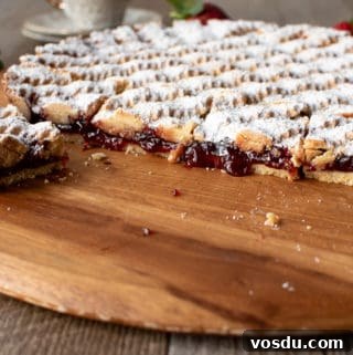 Perfectly Rustic Strawberry Crostata Recipe for Summer Baking 3 Strawberry crostata recipe cut with jam oozing