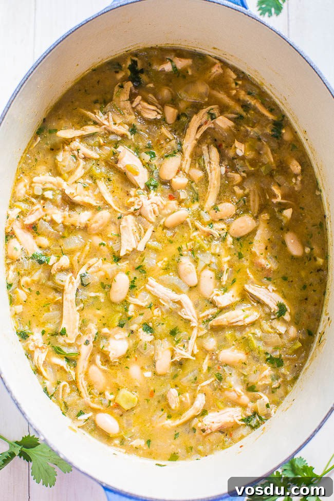 Easy 30-Minute Homemade White Chicken Chili in a slow cooker.