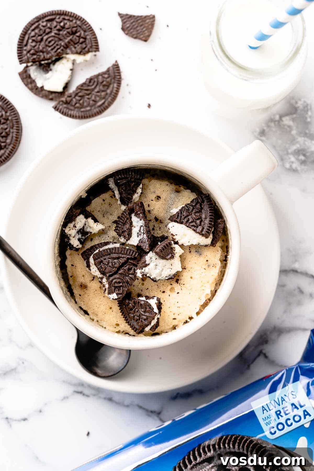 3-Minute Oreo Mug Cake Recipe You Can Make in a Microwave 12 Mug cake with Oreos crumbled on top and spoon on the side
