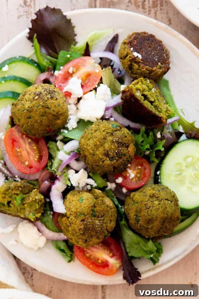 Sweet Potato Falafel Recipe: Crispy, Vegan Middle Eastern Bites 11 homemade sweet potato falafels on a Greek salad