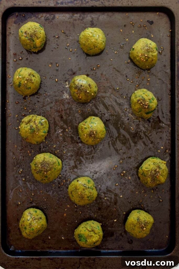 Sweet Potato Falafel Recipe: Crispy, Vegan Middle Eastern Bites 8 homemade sweet potato falafels on a making sheet before baking