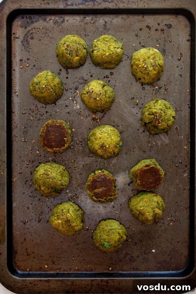 Sweet Potato Falafel Recipe: Crispy, Vegan Middle Eastern Bites 9 crispy homemade sweet potato falafels baked on a sheet
