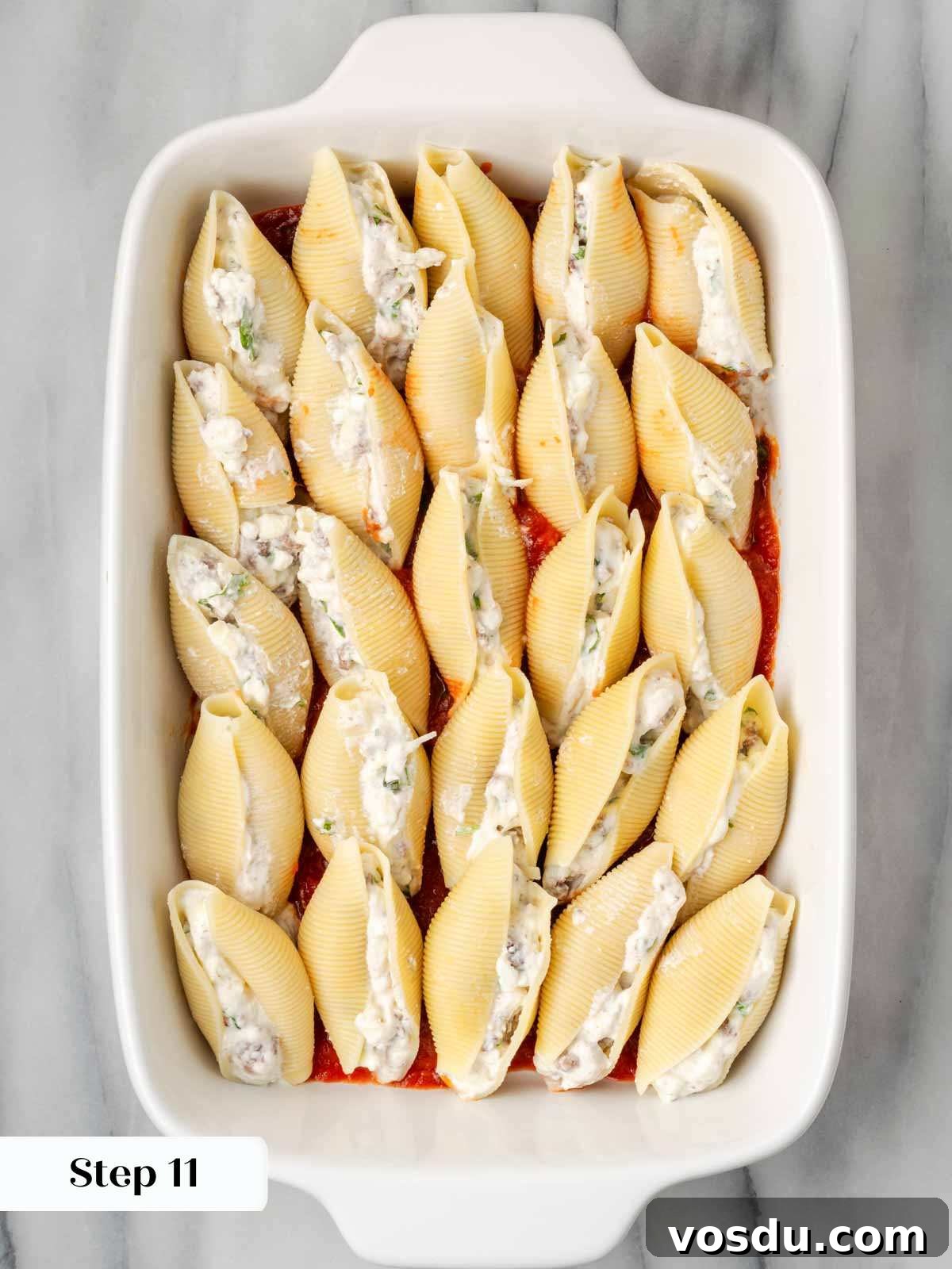 Cheesy Baked Stuffed Shells with Italian Meat Filling 12 stuffed shells unbaked in casserole dish.
