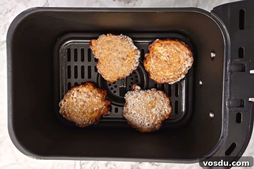 Air Fryer Trader Joe’s Frozen Latkes (Crispy Potato Pancakes) 5 trader joe's latkes in air fryer basket