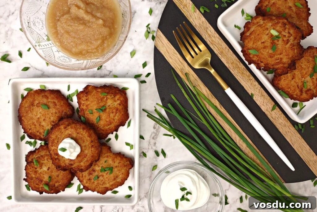 Air Fryer Trader Joe’s Frozen Latkes (Crispy Potato Pancakes) 6 overhead view of trader joe's latkes on a plate with applesauce