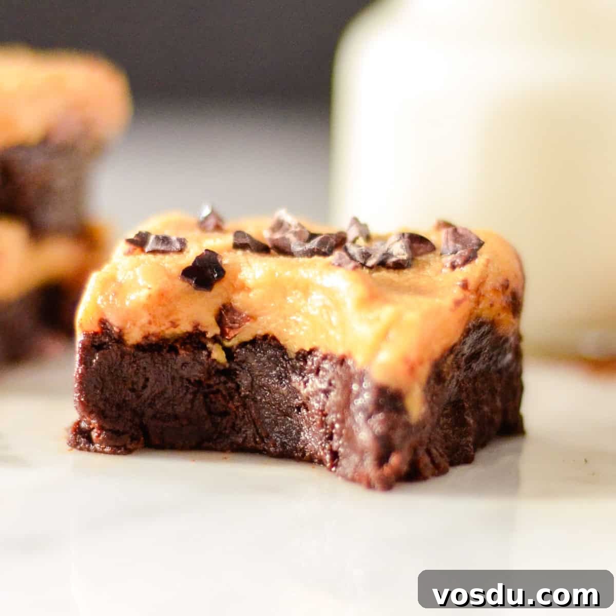 Flourless Peanut Butter Brownies Recipe — Fudgy & Gluten-Free 11 a flourless peanut butter brownie with peanut butter frosting and a bite taken out of it