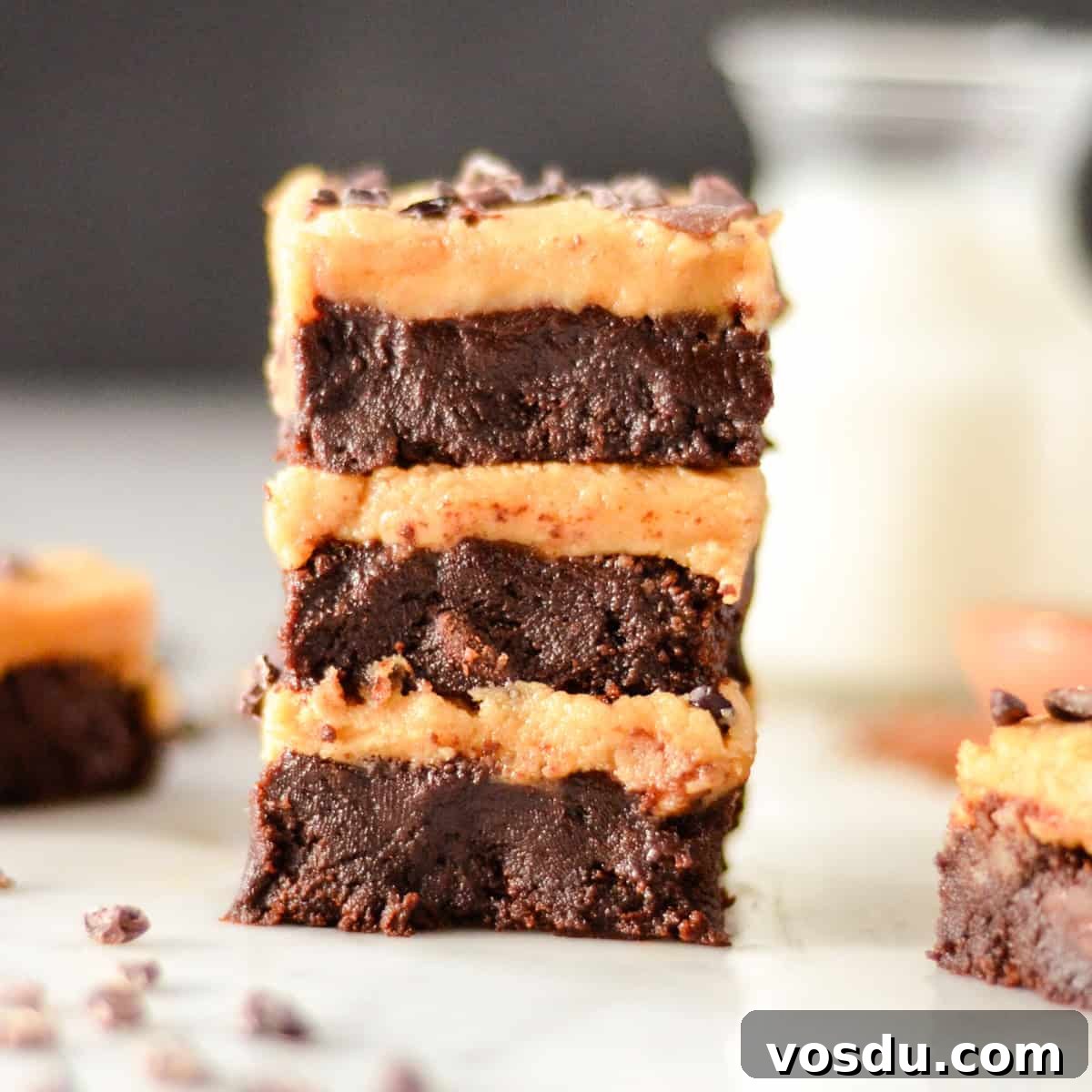 Flourless Peanut Butter Brownies Recipe — Fudgy & Gluten-Free 4 a stack of 3 Flourless Peanut Butter Brownies with peanut butter frosting