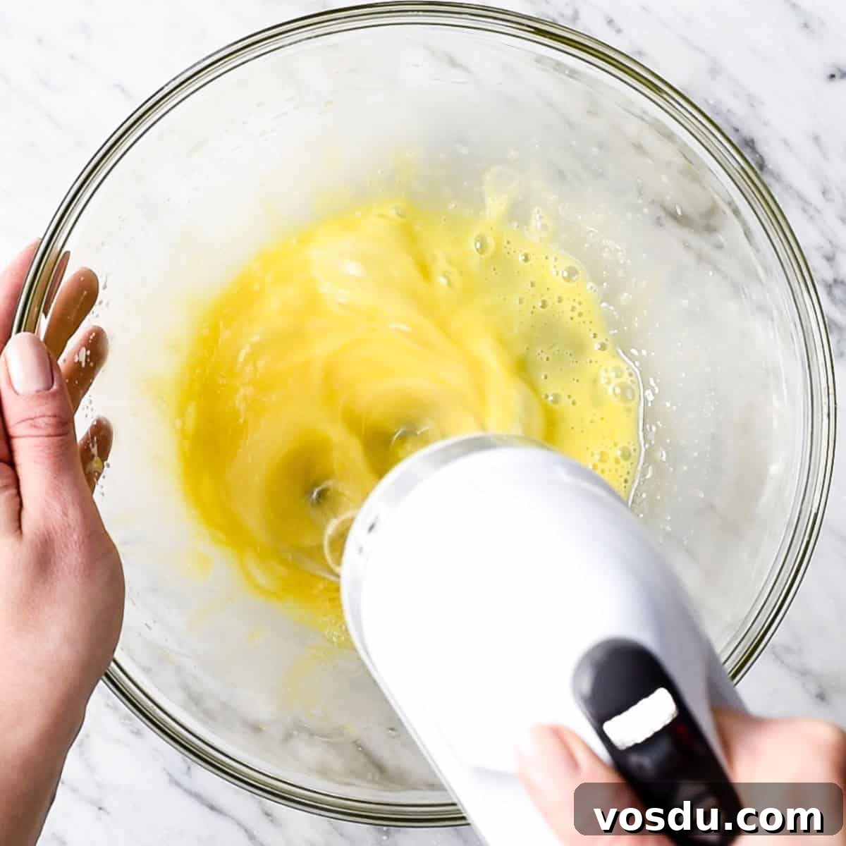 Flourless Peanut Butter Brownies Recipe — Fudgy & Gluten-Free 7 How to Make Flourless Peanut Butter Brownies beating eggs and sugar with a mixer in a bowl