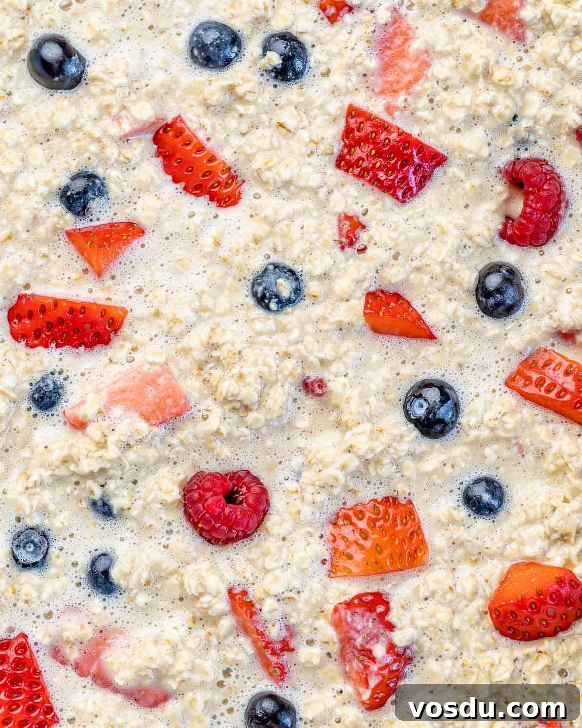 raw oatmeal mixture with berries before baking