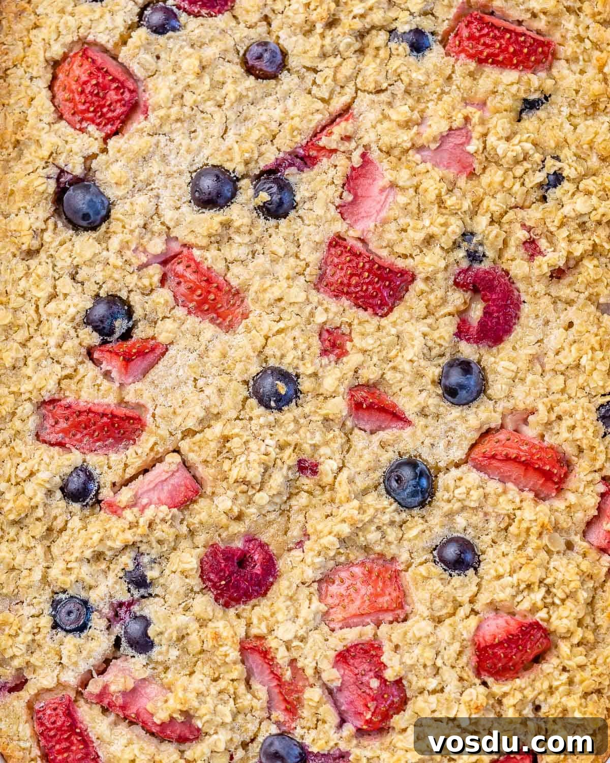baked oatmeal with berries still in pan before slicing