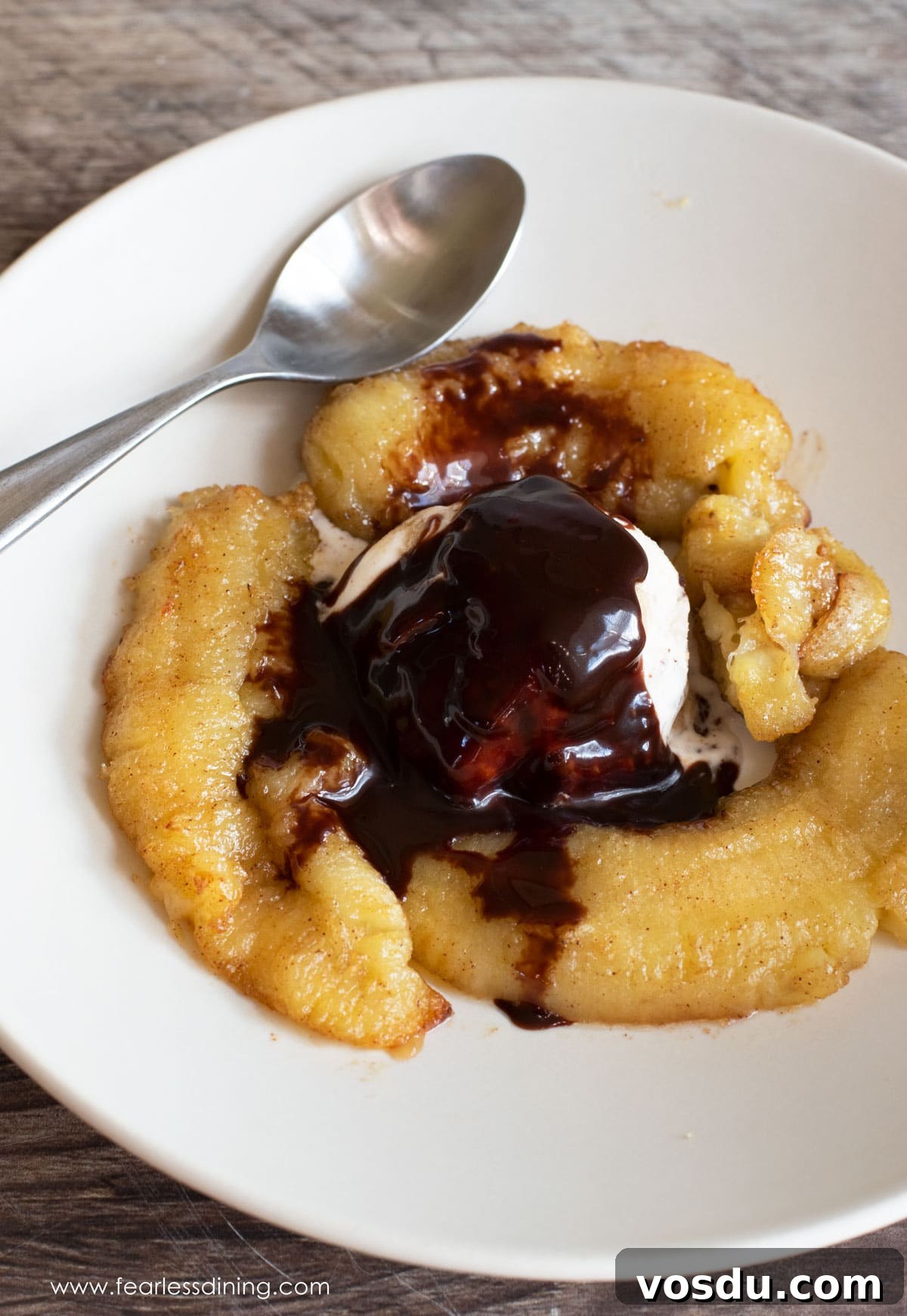 Crispy Caramelized Bananas in the Air Fryer: Quick Recipe 8 The top view of the caramelized bananas with ice cream and chocolate sauce.