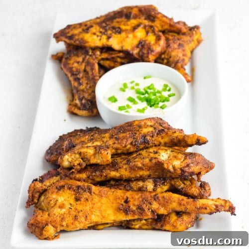 Closeup of chicken tenders on a serving platter.