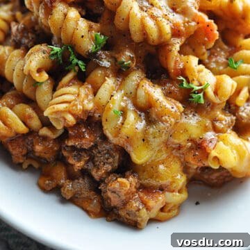 Slow Cooker Hungarian Goulash Recipe for Tender Beef 10 Goulash with rotini pasta, ground beef, and cheese.