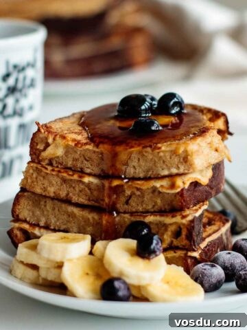 sourdough french toast with butter, berries, bananas and maple syrup