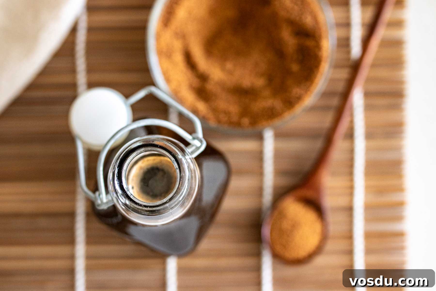 Coconut Sugar Syrup Recipe for Coffee, Drinks & Boba 16 A bottle of syrup and coconut sugar.