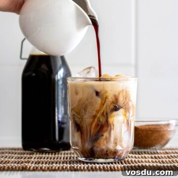 Coconut Sugar Syrup Recipe for Coffee, Drinks & Boba 17 Coconut sugar syrup pouring over beverage.