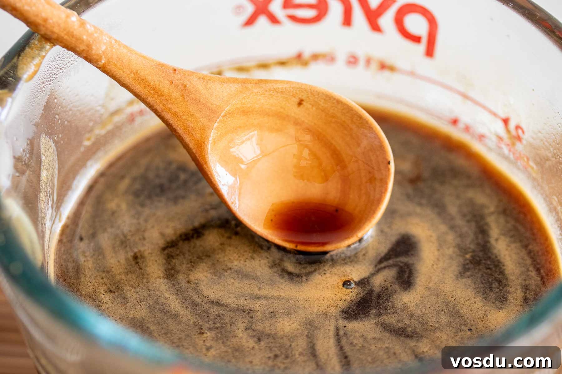 Coconut Sugar Syrup Recipe for Coffee, Drinks & Boba 7 Spoon with syrup and foam that can form after boiling.