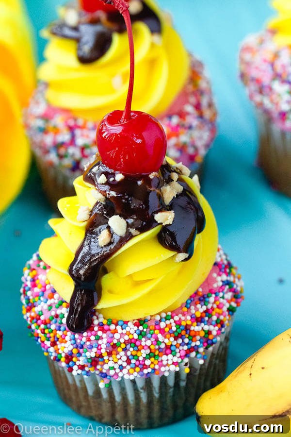 Banana Split Cupcakes Banana split cupcakes with strawberry and vanilla buttercream, sprinkles, chocolate sauce, chopped nuts and a cherry