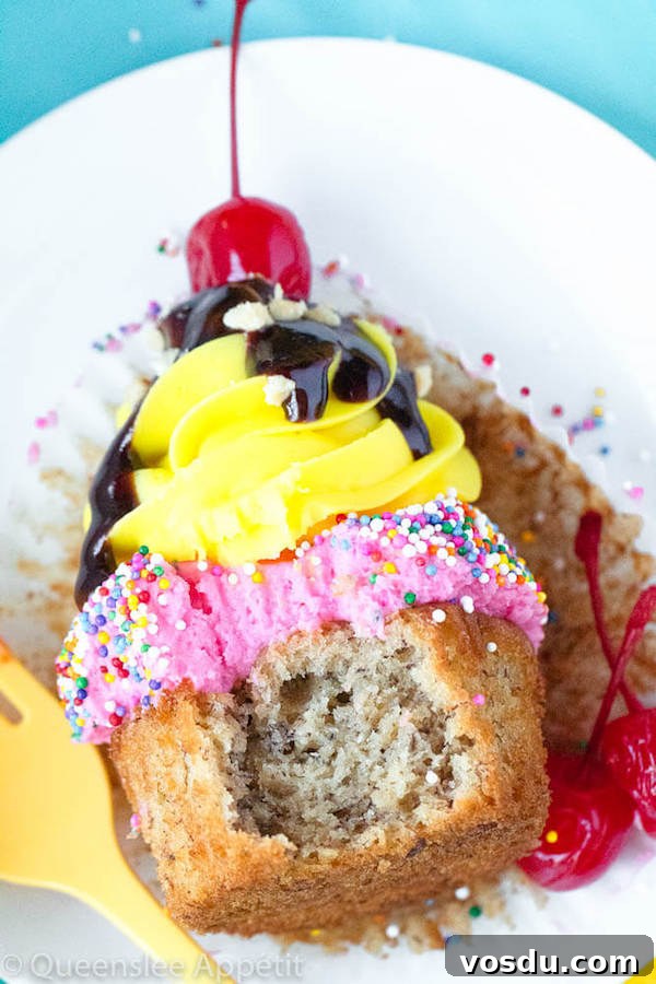 Banana Split Cupcakes Banana split cupcakes with strawberry and vanilla buttercream, sprinkles, chocolate sauce, chopped nuts and a cherry