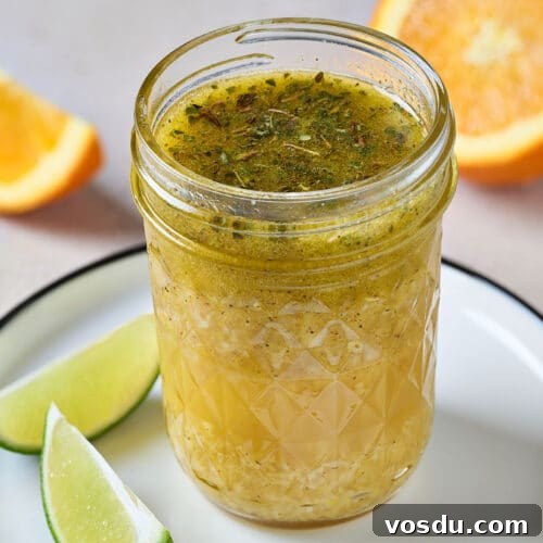 Authentic Cuban Mojo Sauce Recipe for Marinades & Dips 14 citrus Cuban Mojo sauce in a glass container