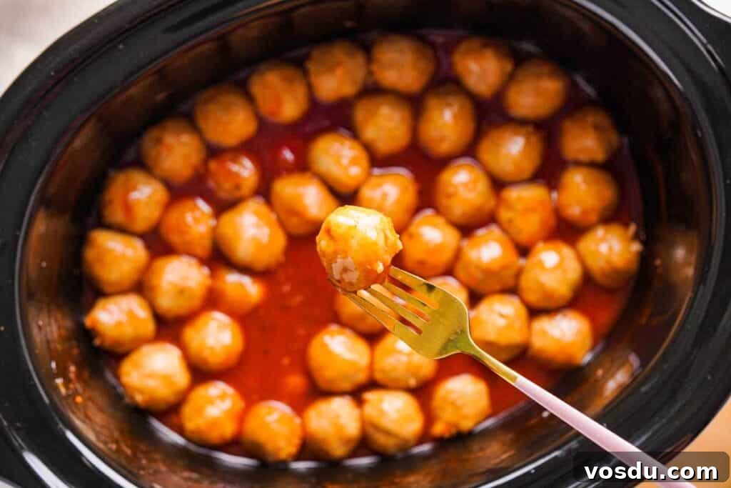 Slow-Cooker Apple Jelly Meatballs for Party Appetizers 5 close up of apple jelly meatballs