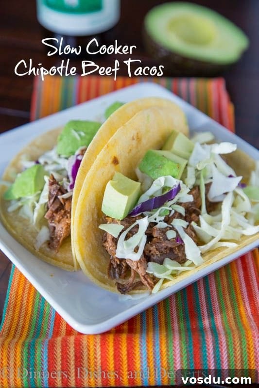 Chipotle Slow-Cooker Beef Tacos for Flavorful Weeknight Meals 2 slow cooker chipotle beef tacos on a plate