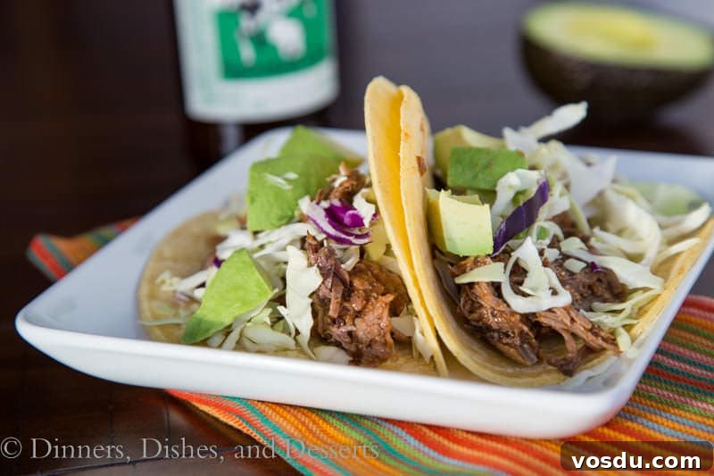 Chipotle Slow-Cooker Beef Tacos for Flavorful Weeknight Meals 3 slow cooker chipotle beef tacos on a plate