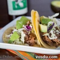 Chipotle Slow-Cooker Beef Tacos for Flavorful Weeknight Meals 5 slow cooker chipotle beef tacos on a plate