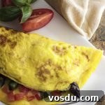 Take advantage of fresh asparagus to make a healthy spring omelette! This asparagus omelette is full of smoked gouda cheese, sauteed onions, and tomatoes. Great for breakfast, brunch, or even dinner.