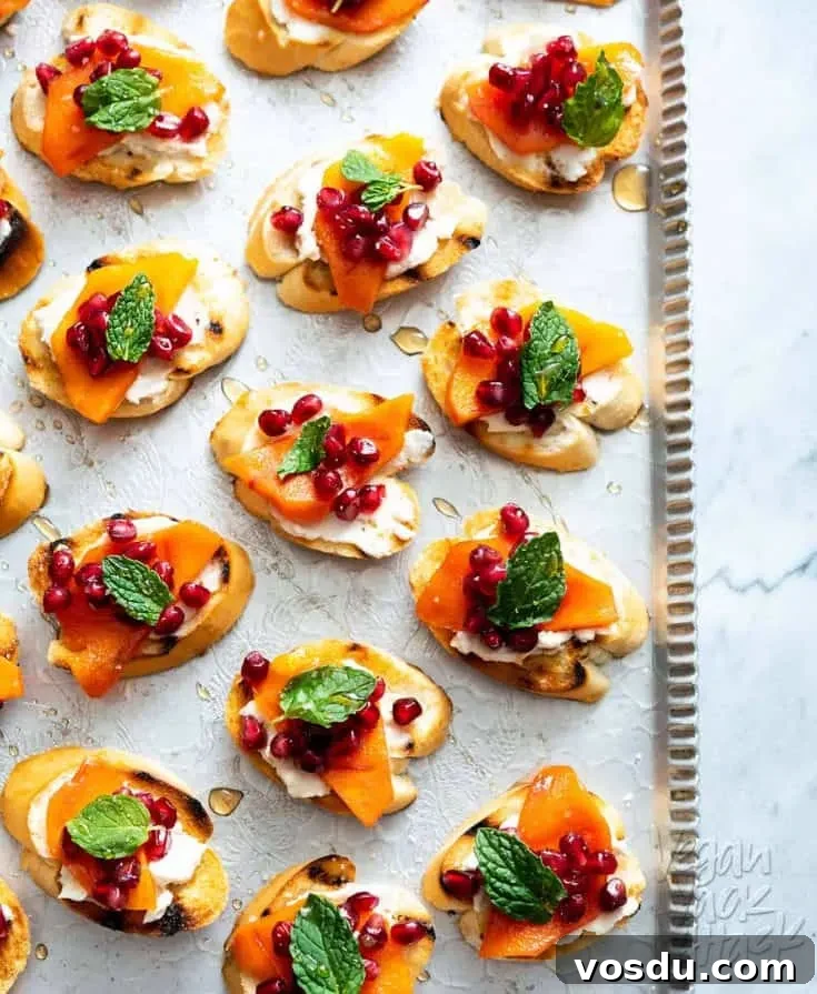 These Pomegranate Persimmon Crostini are as delicious as they are gorgeous. Plus, VERY easy-to-make! #vegan #soyfree #appetizer #veganyackattack