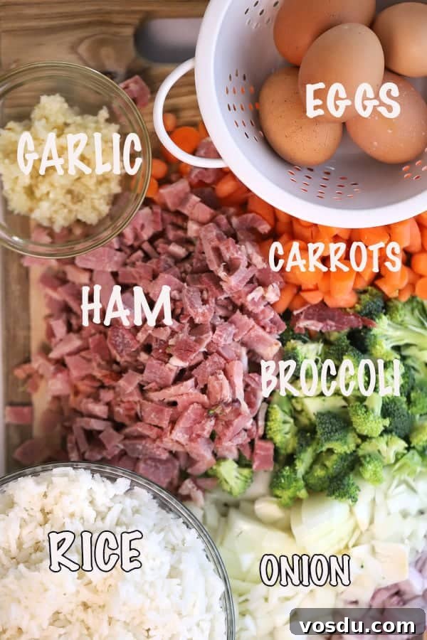 Ingredients for making ham fried rice out on a table.