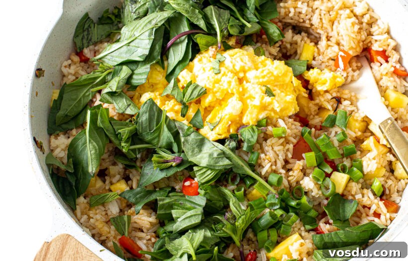 Authentic Thai Pineapple Fried Rice Recipe with Shrimp and Cashews 7 Thai Fried Rice Ingredients in a white skillet.