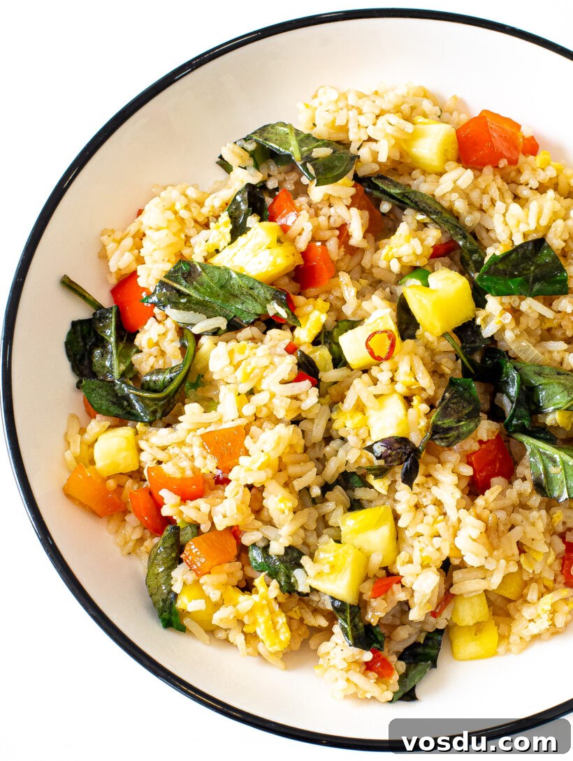 Authentic Thai Pineapple Fried Rice Recipe with Shrimp and Cashews 9 Thai Pineapple Fried Rice in a white bowl.