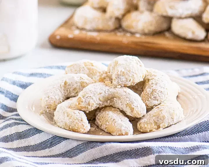 Buttery Almond Crescent Cookies Recipe for Tender, Nutty Crescents 6 plate of cookies on a striped dishtowel