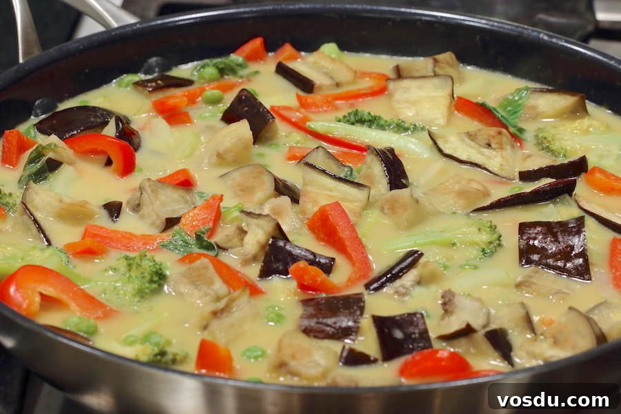 Soy-Free Vegetarian Thai Green Curry Recipe for Flavorful Meals 4 Vegetarian Thai Green Curry cooking in a large skillet