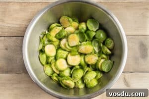Crispy Roasted Brussels Sprouts with Feta and Lemon Zest 18 This is a picture of a bowl of Brussels sprouts seasoned with spices.