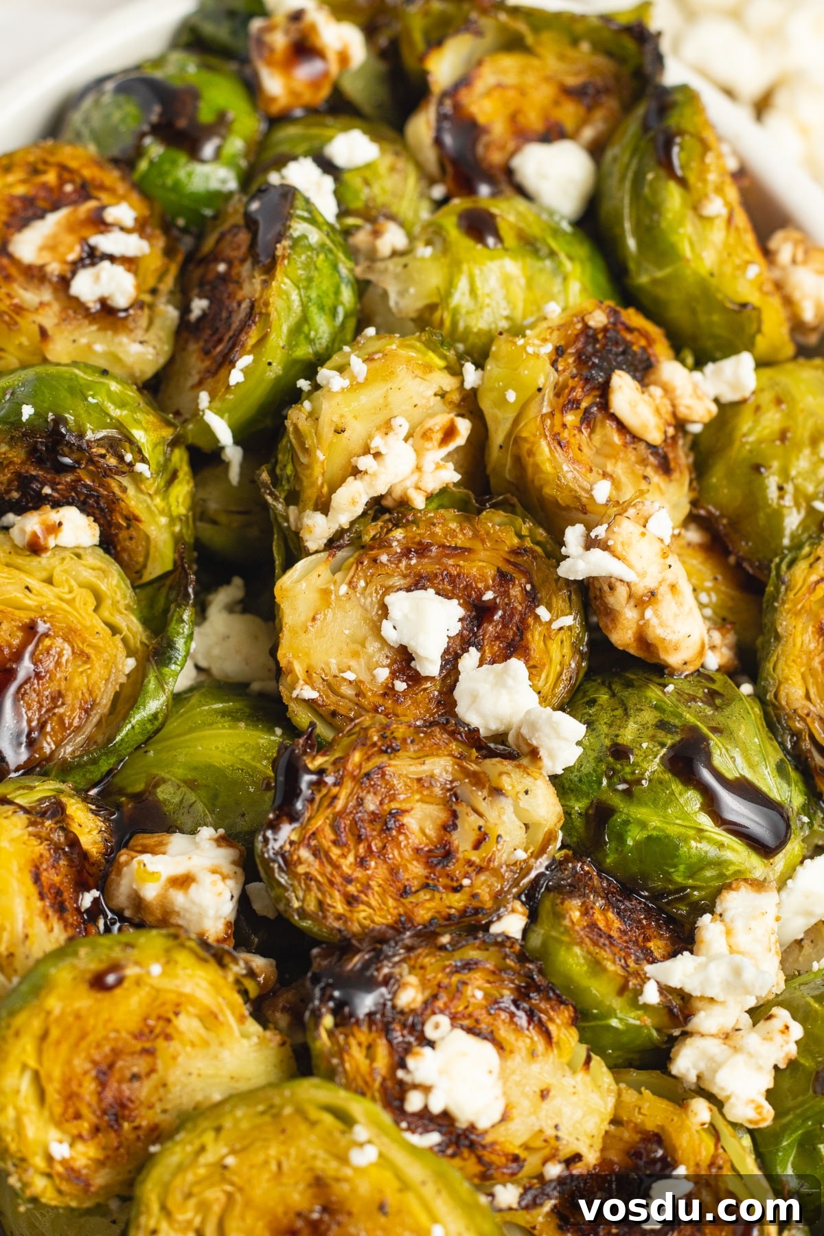 Crispy Roasted Brussels Sprouts with Feta and Lemon Zest 3 This is a close-up picture of a bowl of Brussels sprouts.