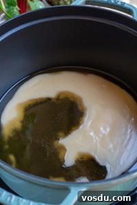 Authentic Mexican Carnitas: Slow-Cooked Pork Confit Recipe 14 Melting lard