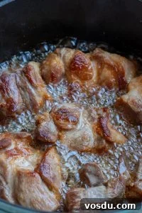 Authentic Mexican Carnitas: Slow-Cooked Pork Confit Recipe 16 Flipping pork