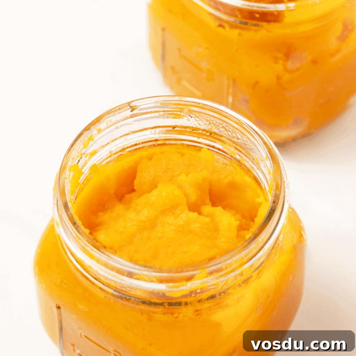 two mason jars of homemade pumpkin puree